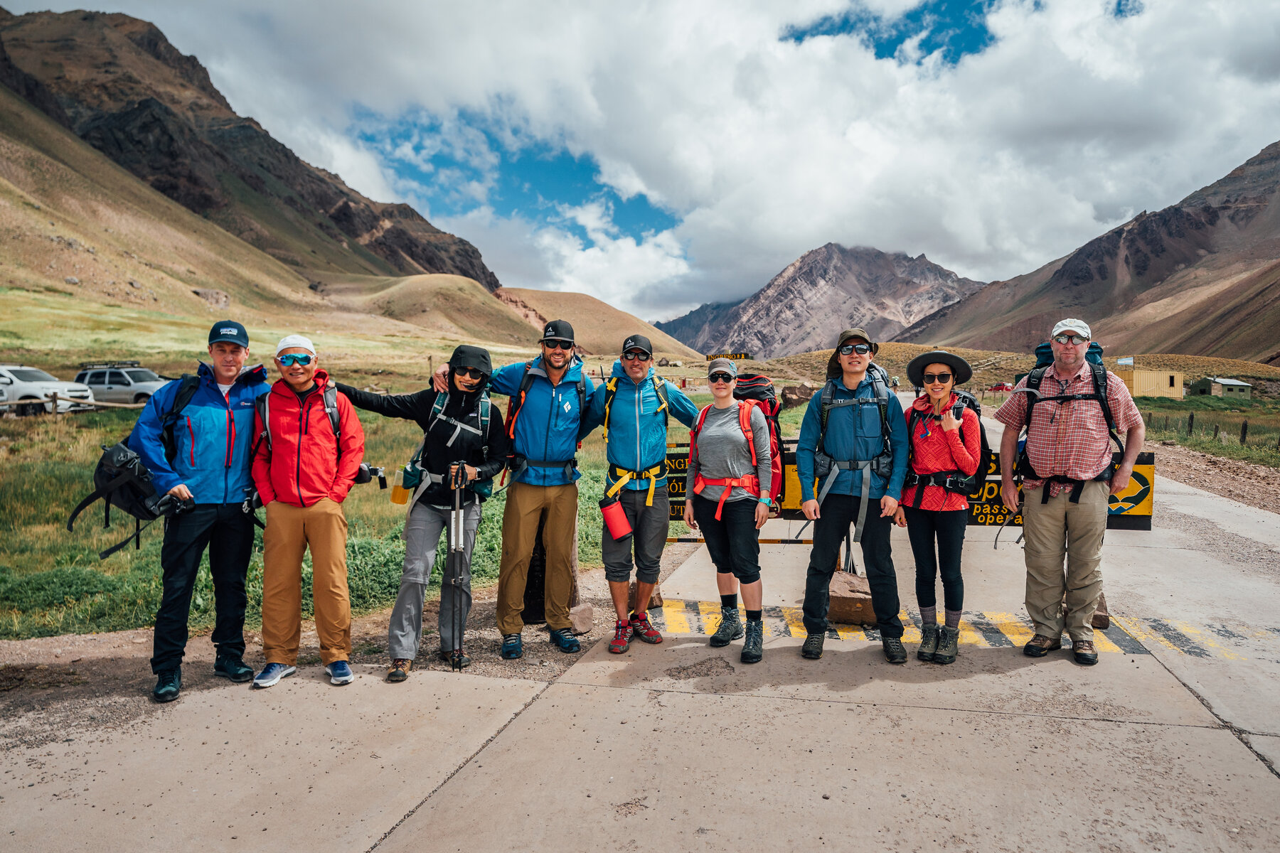 Our expedition team lined up at the Aconcagua park entrance, packs on and ready to start the approach