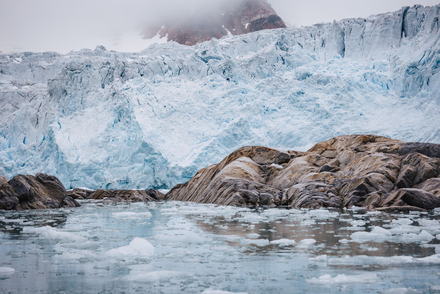 Glacier ice front with moraine debris