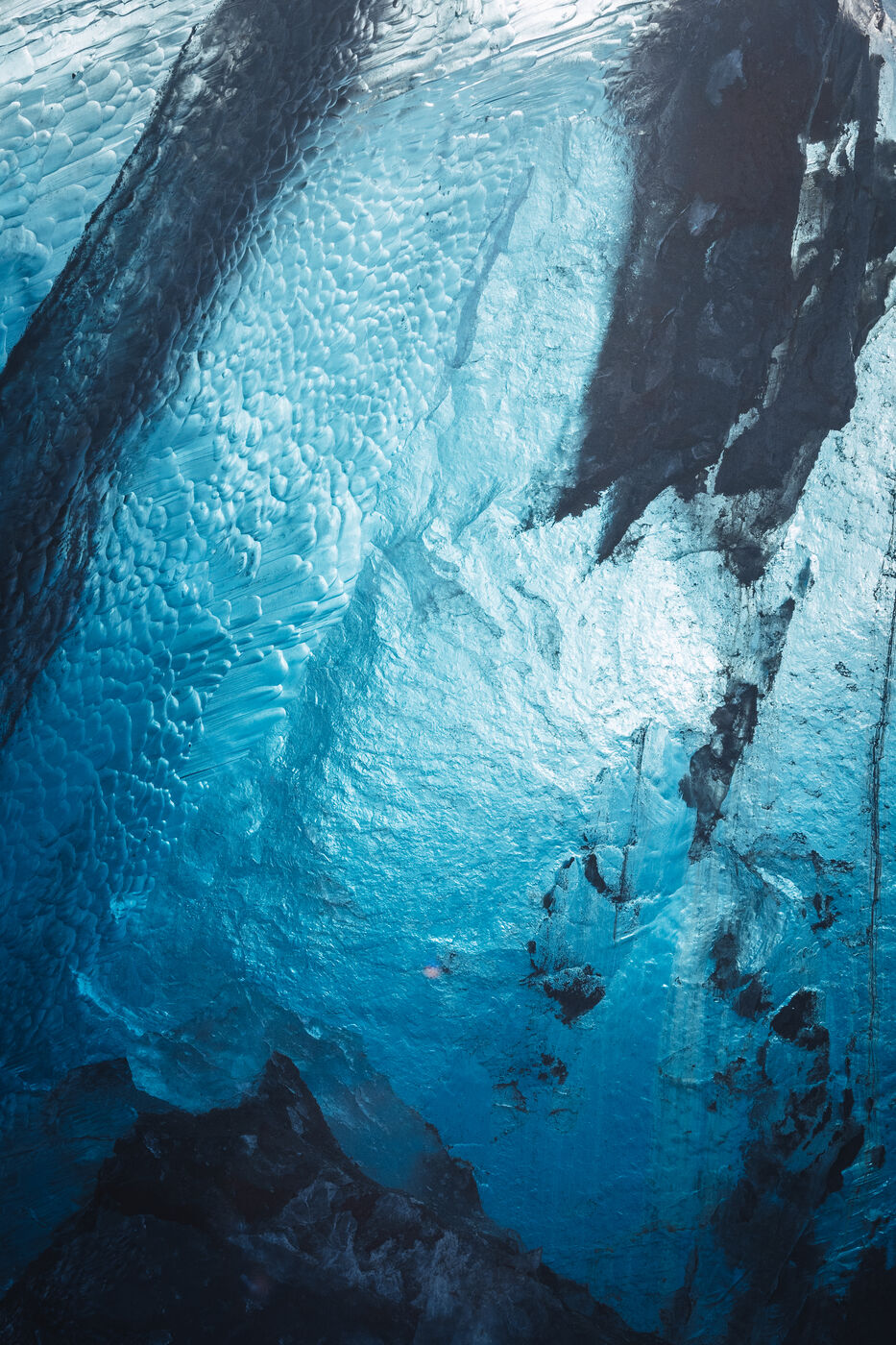 Massive turquoise iceberg revealing blue interior