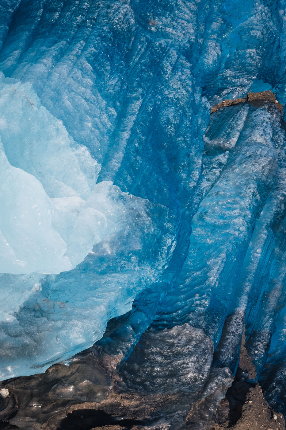 Close texture of turquoise ice with white cap