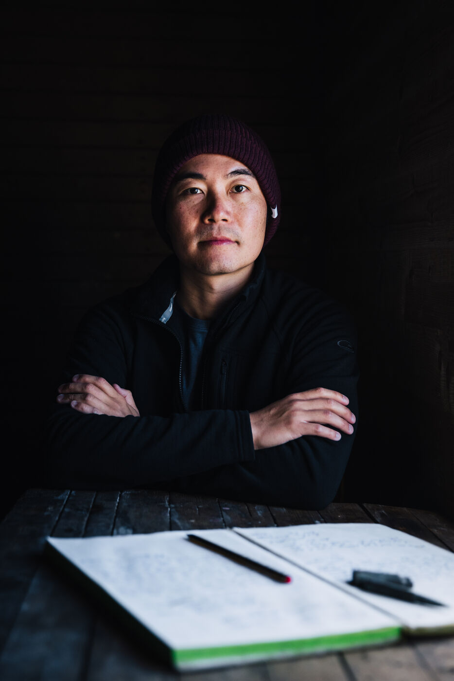Person in dark winter clothing looking thoughtful