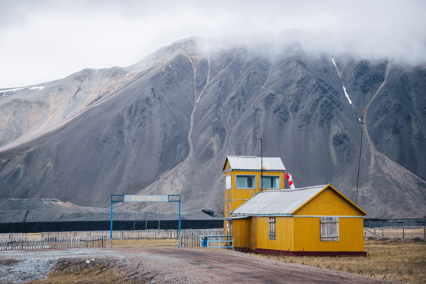Yellow house with mountain backdrop