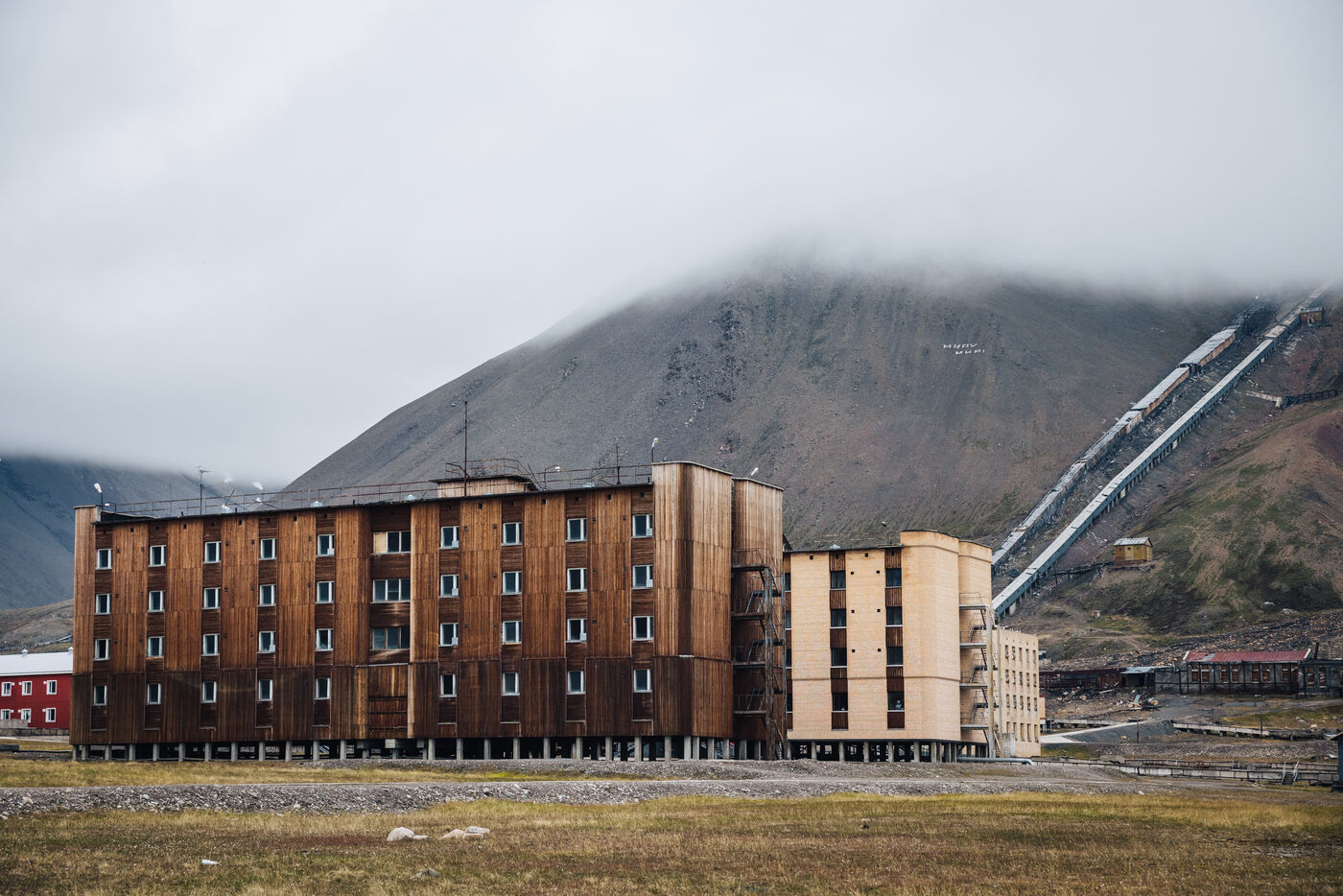 Brown brick building with mining infrastructure