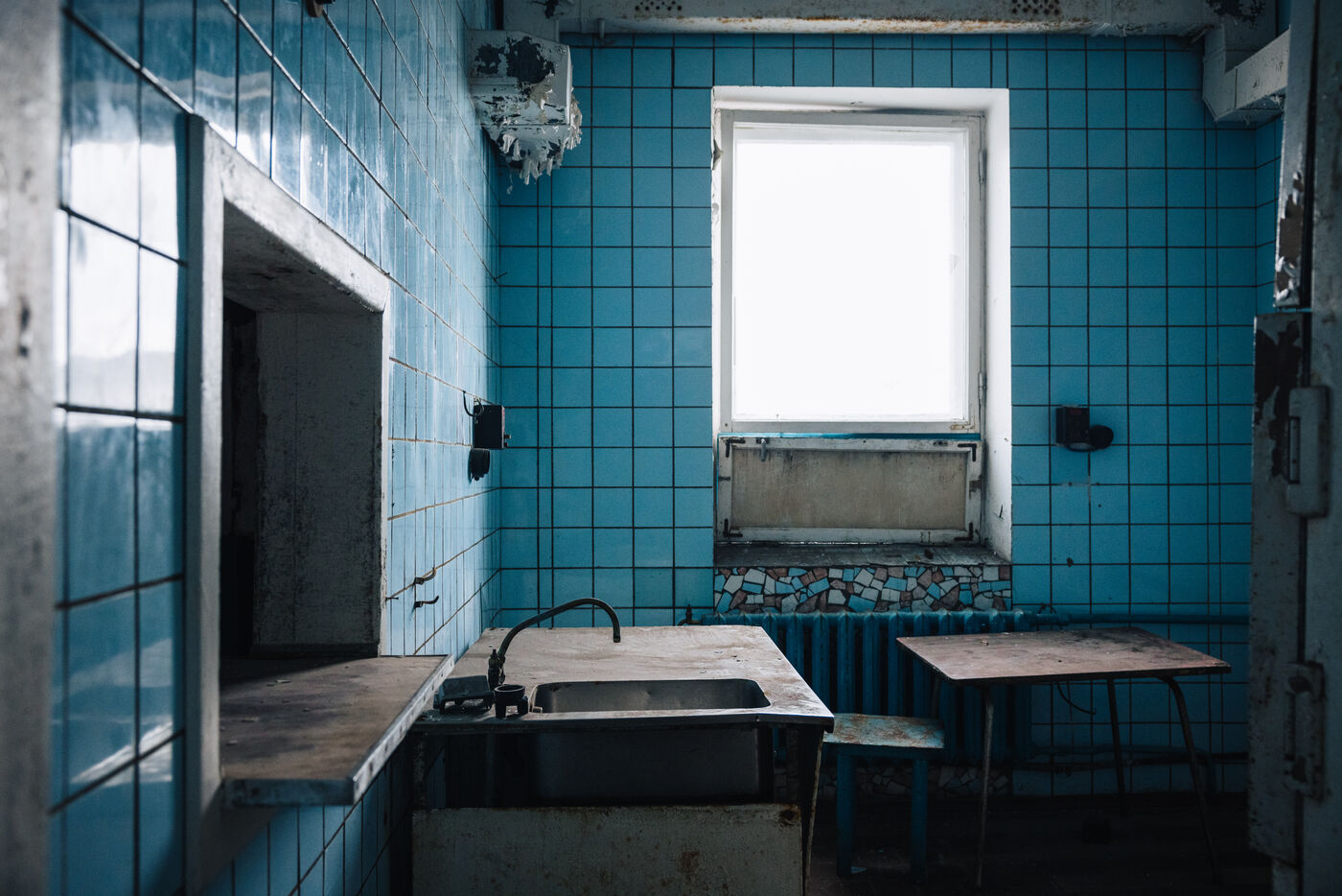 Turquoise bathroom with peeling paint