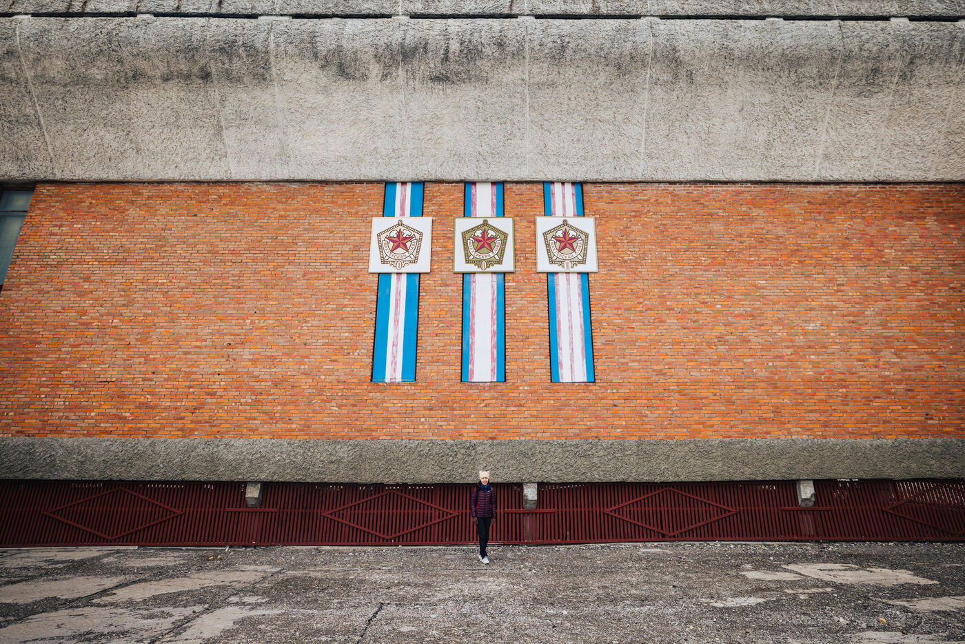 Weathered mural with Soviet sports medals