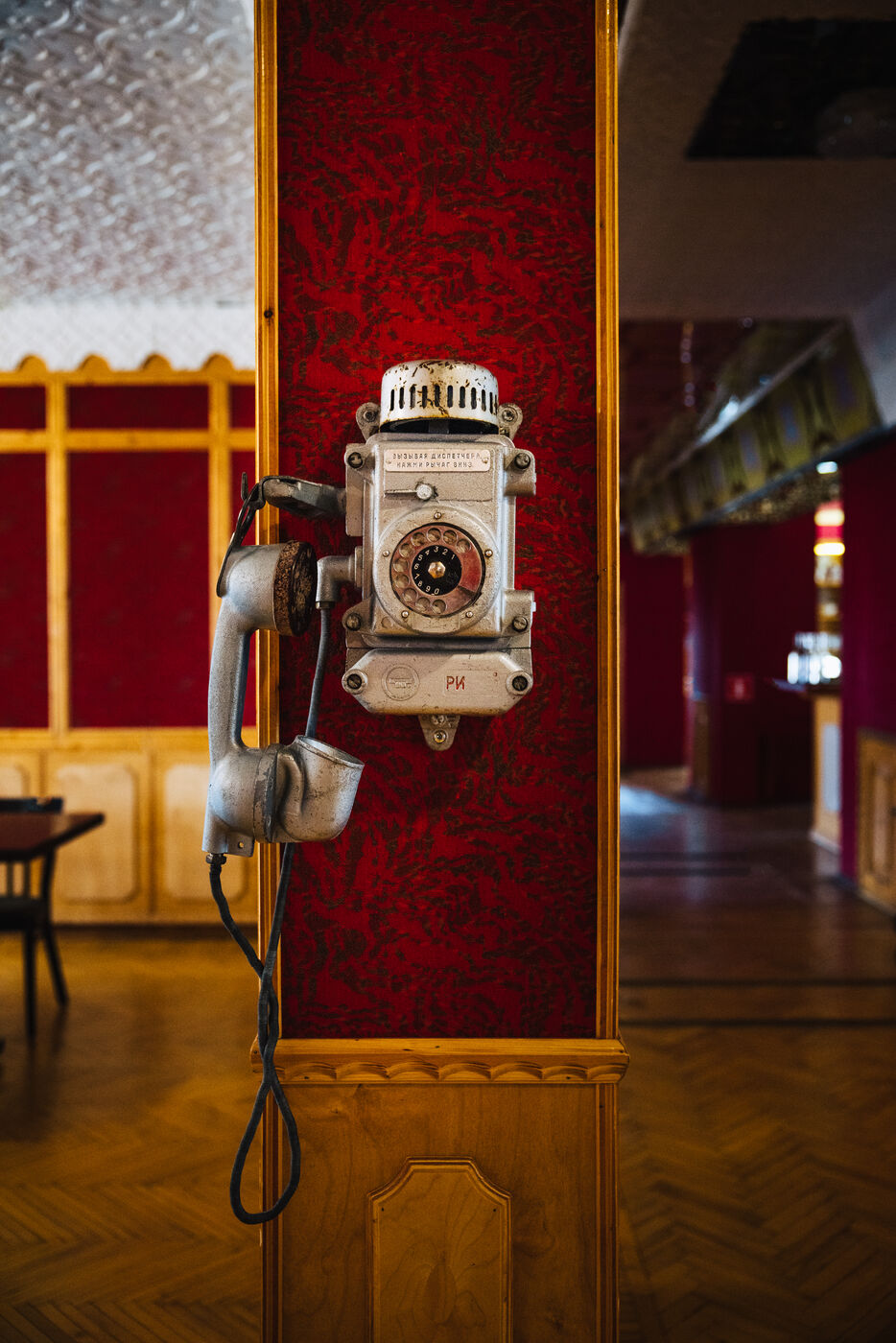 Vintage telephone hanging on building