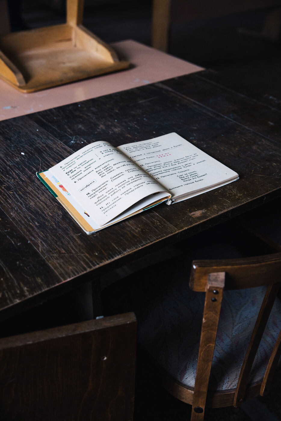 Open notebook on dark wooden desk