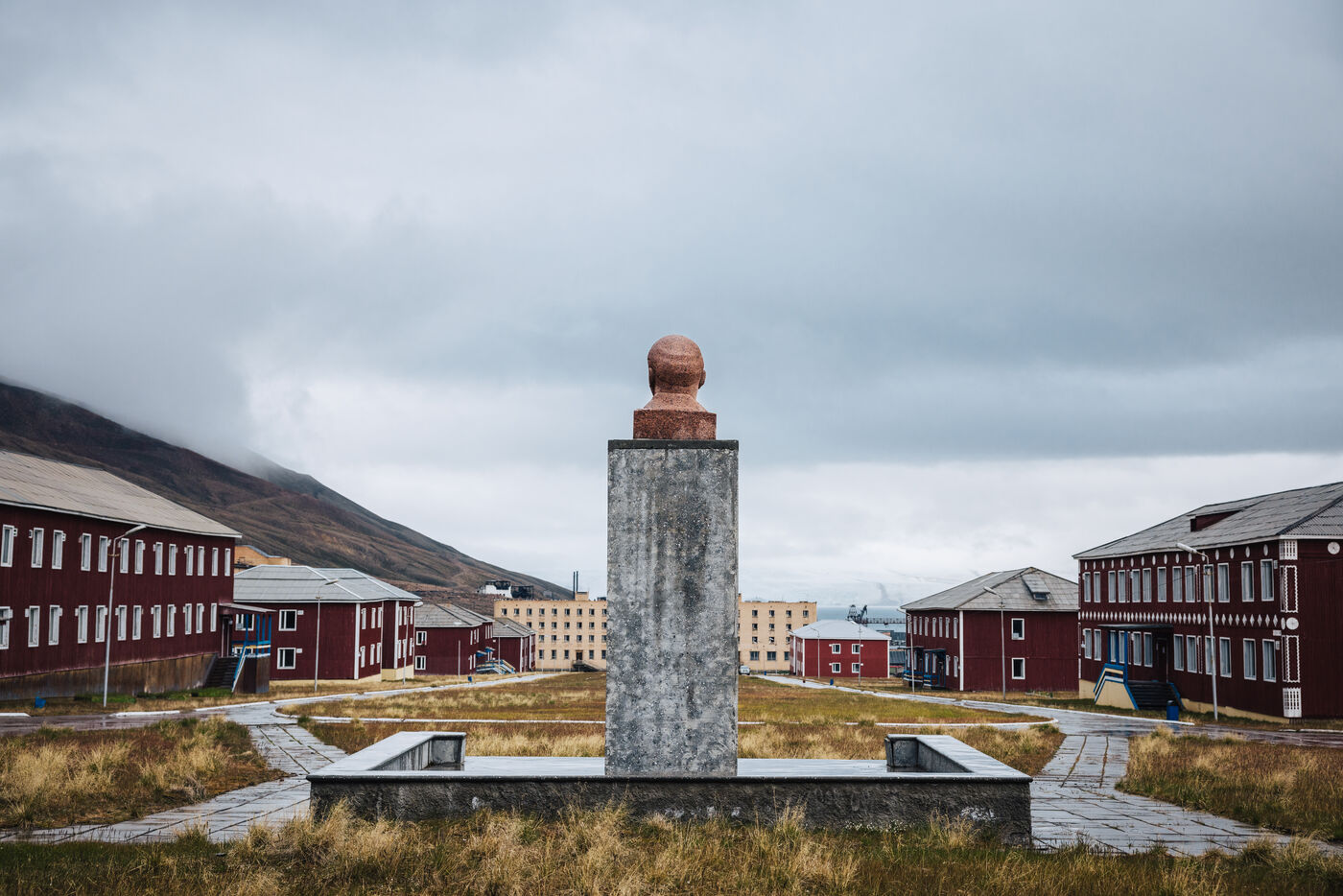 Rear view of the Lenin bust looking down the central avenue toward the fjord