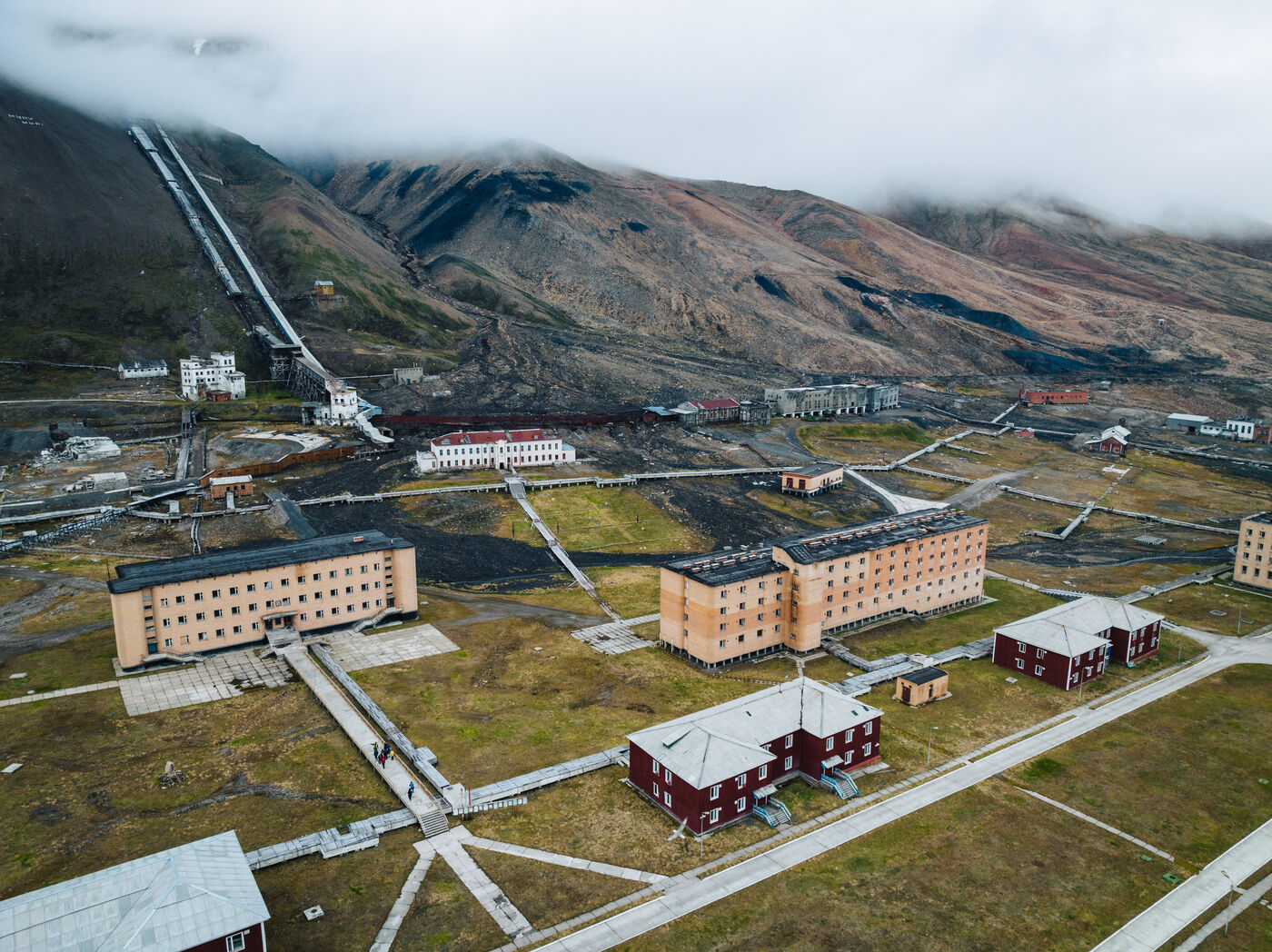 Aerial of settlement buildings in grid pattern