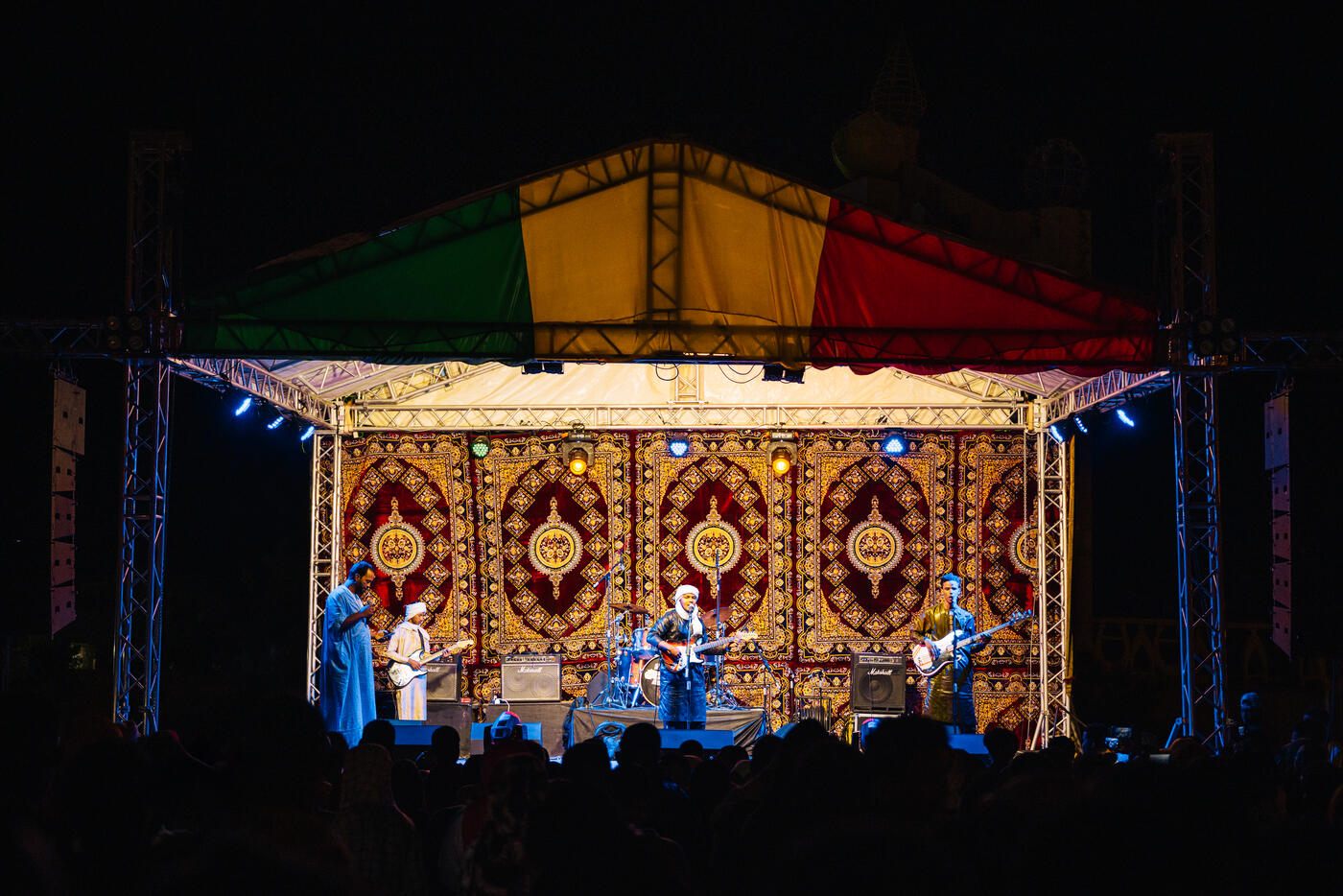 Band performing on stage at night