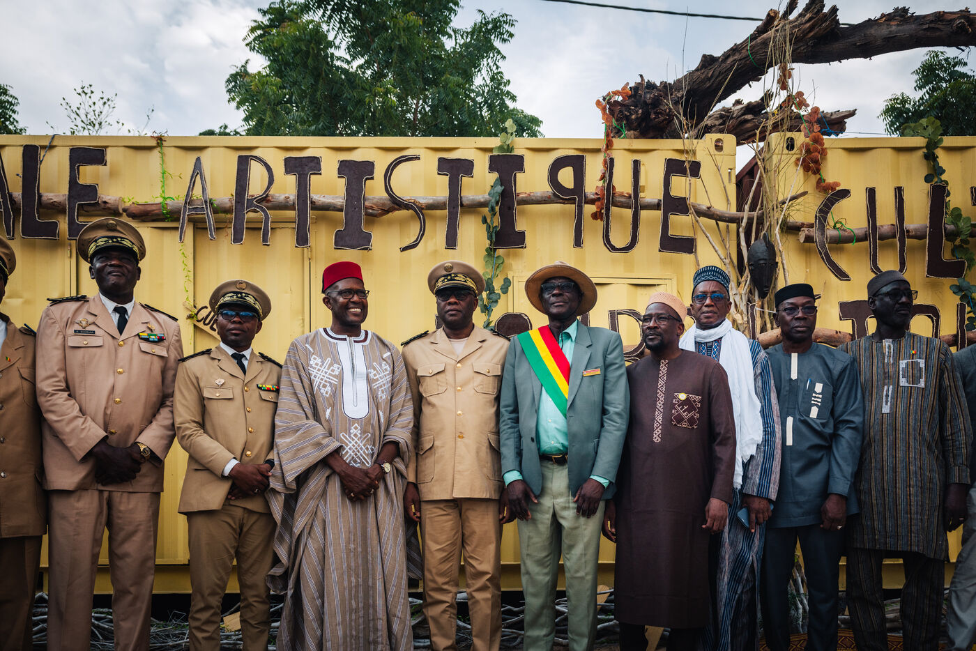 Officials at Artistique Culturelle banner