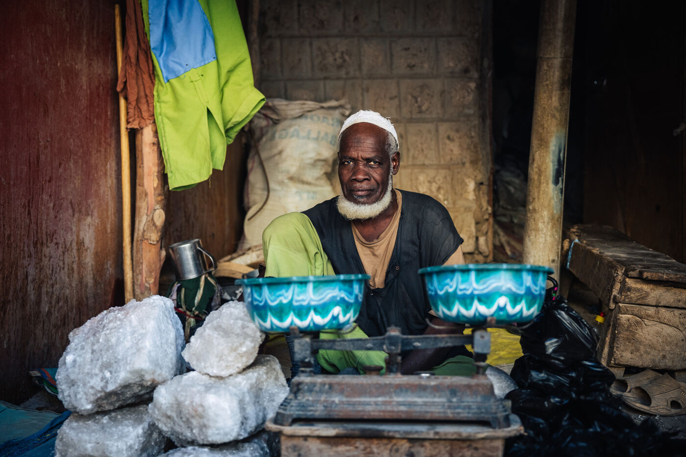 Man vendor with bowls and scale