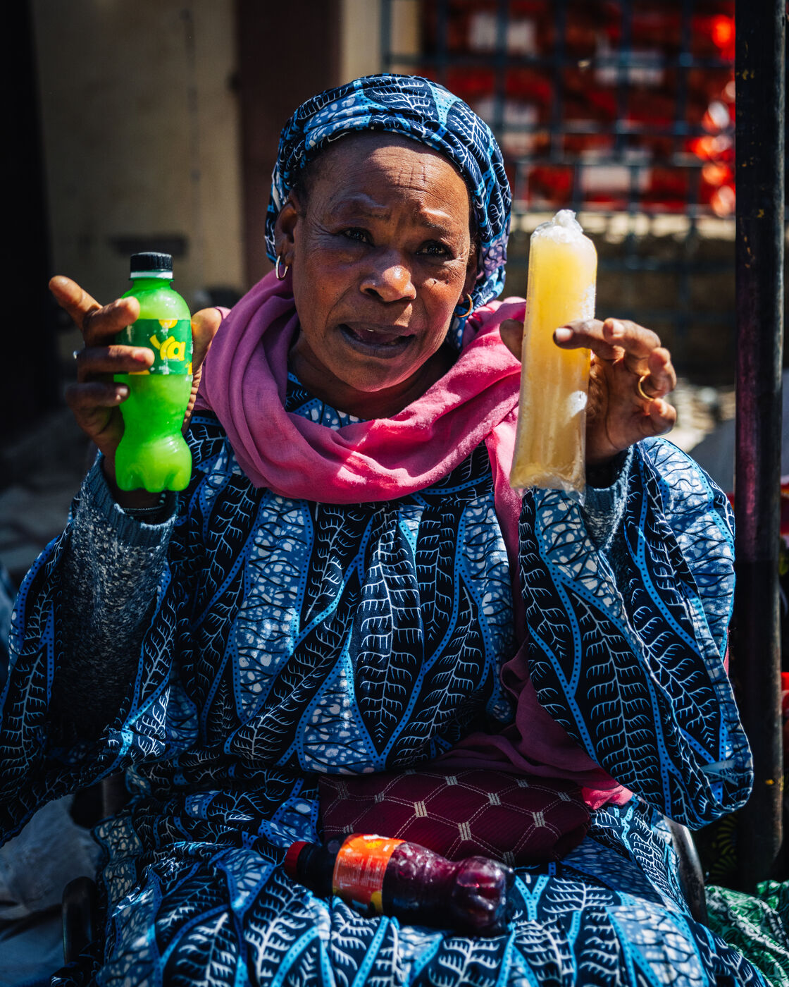 Woman holding bottles at market