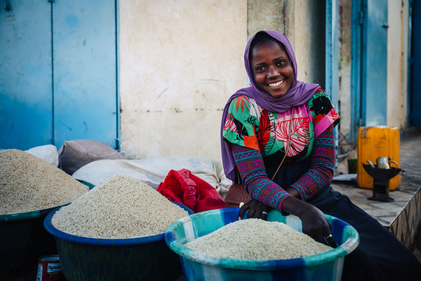 Smiling woman with grain baskets