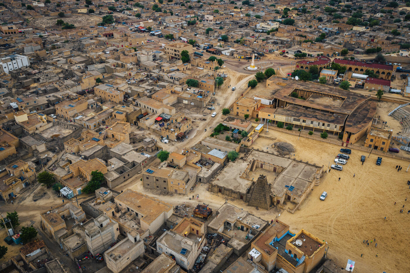 Aerial view of Timbuktu from above showing sand-colored rooftops and ancient mosques
