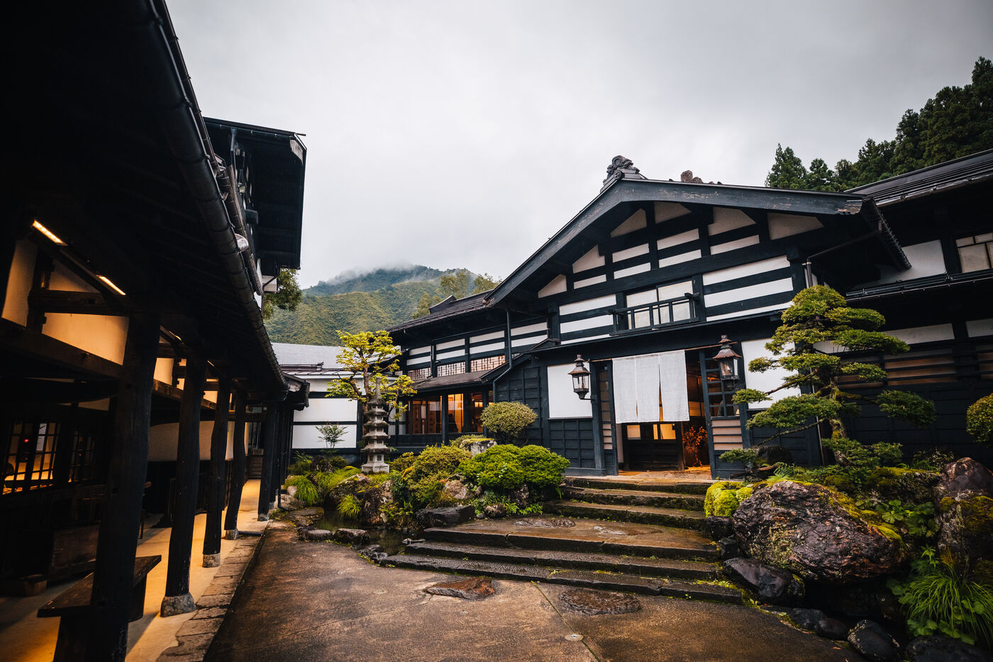 Ryugon ryokan exterior courtyard with mountain views