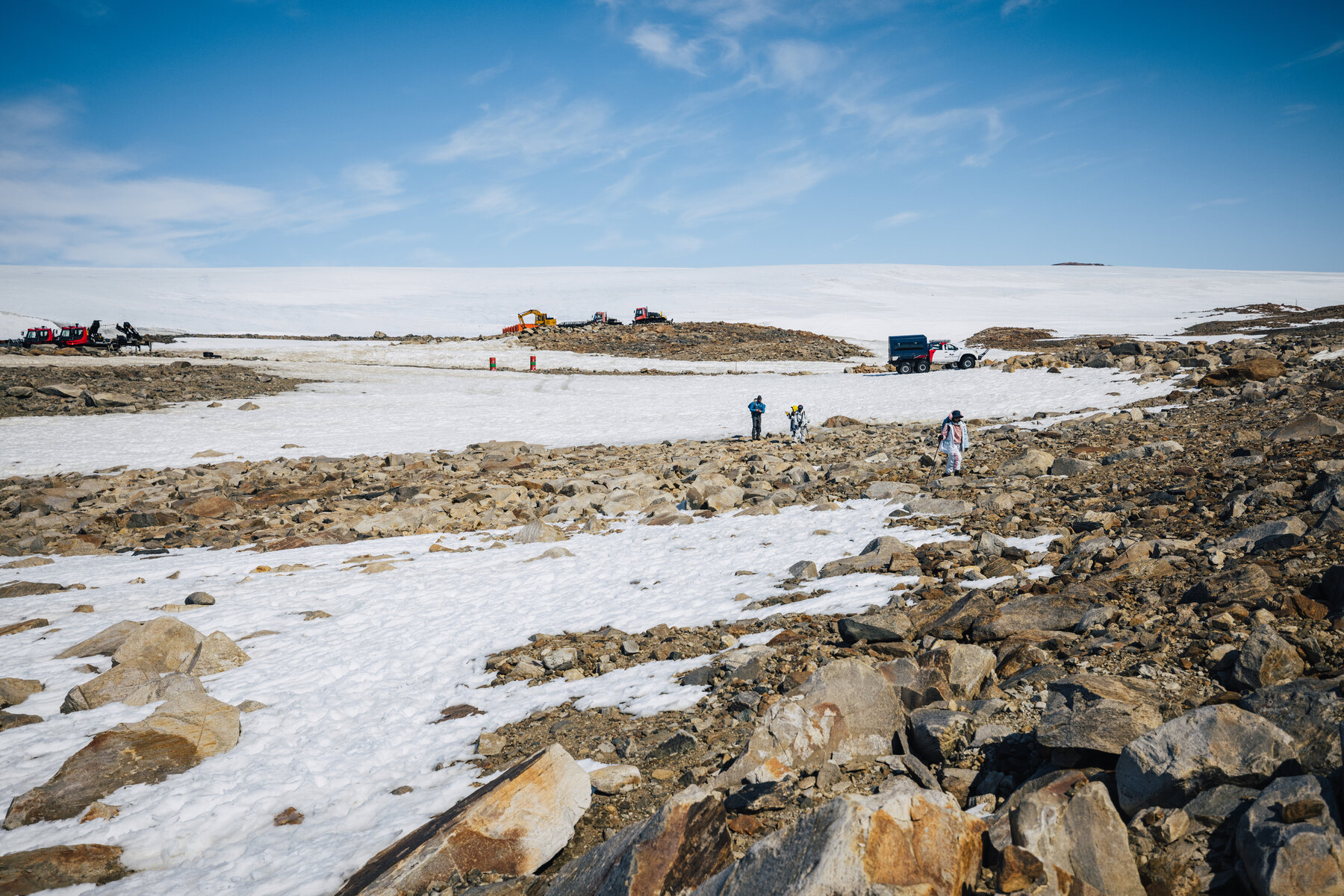 Approach to a remote research outpost at Novolazarevskaya with parked vehicles on the Antarctic plateau