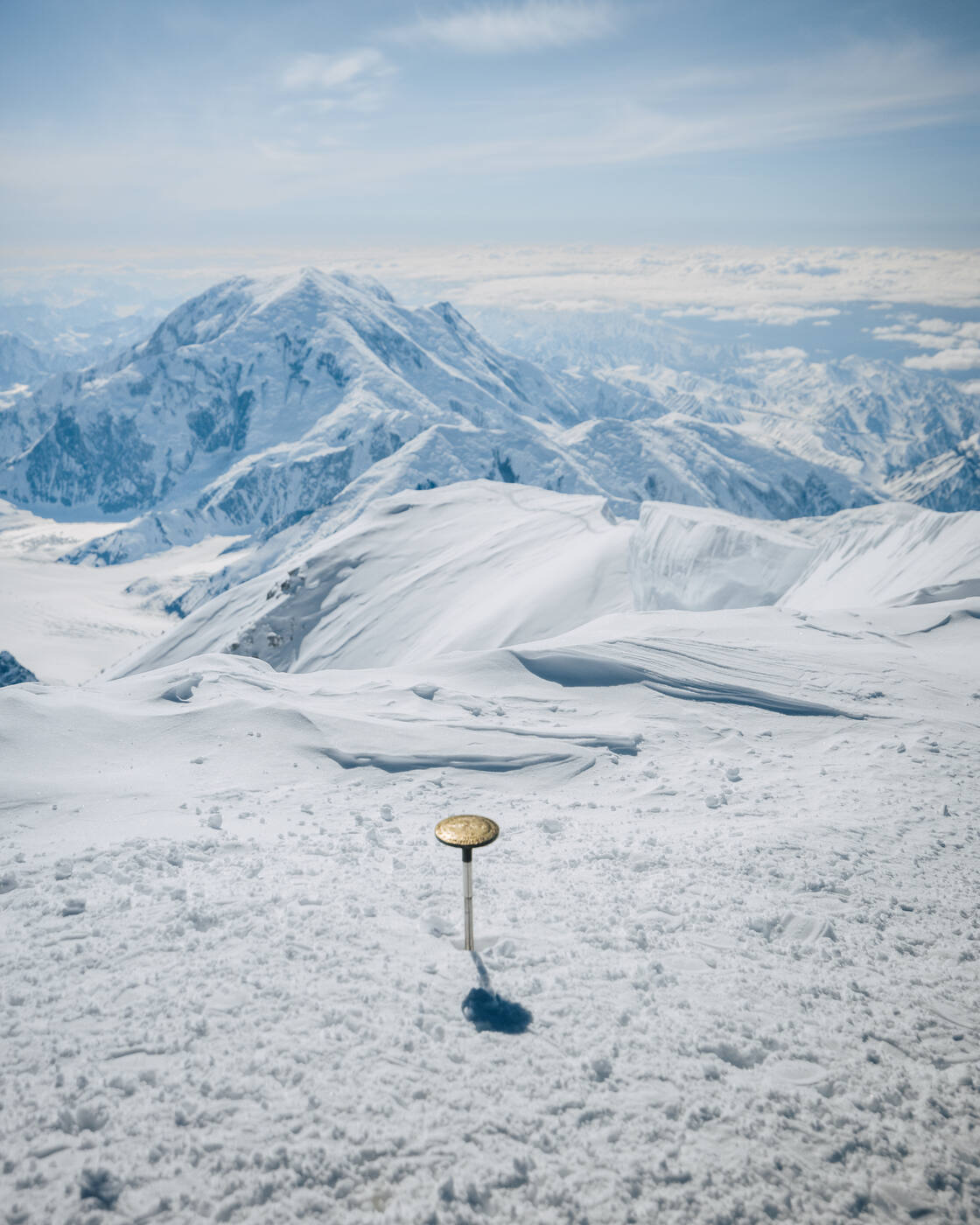 Summit marker with mountain views