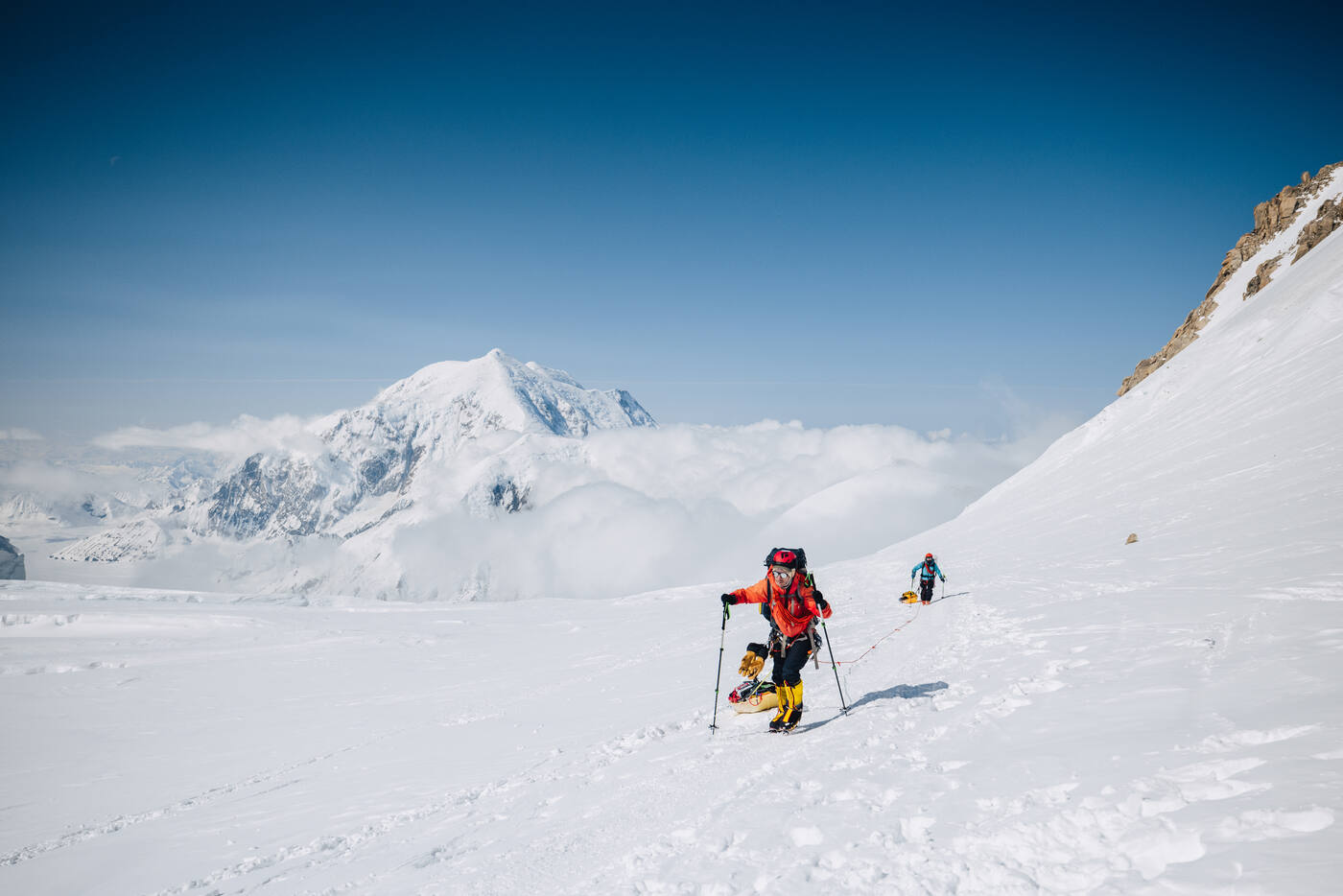 Climbers approaching Windy Corner with exposed terrain