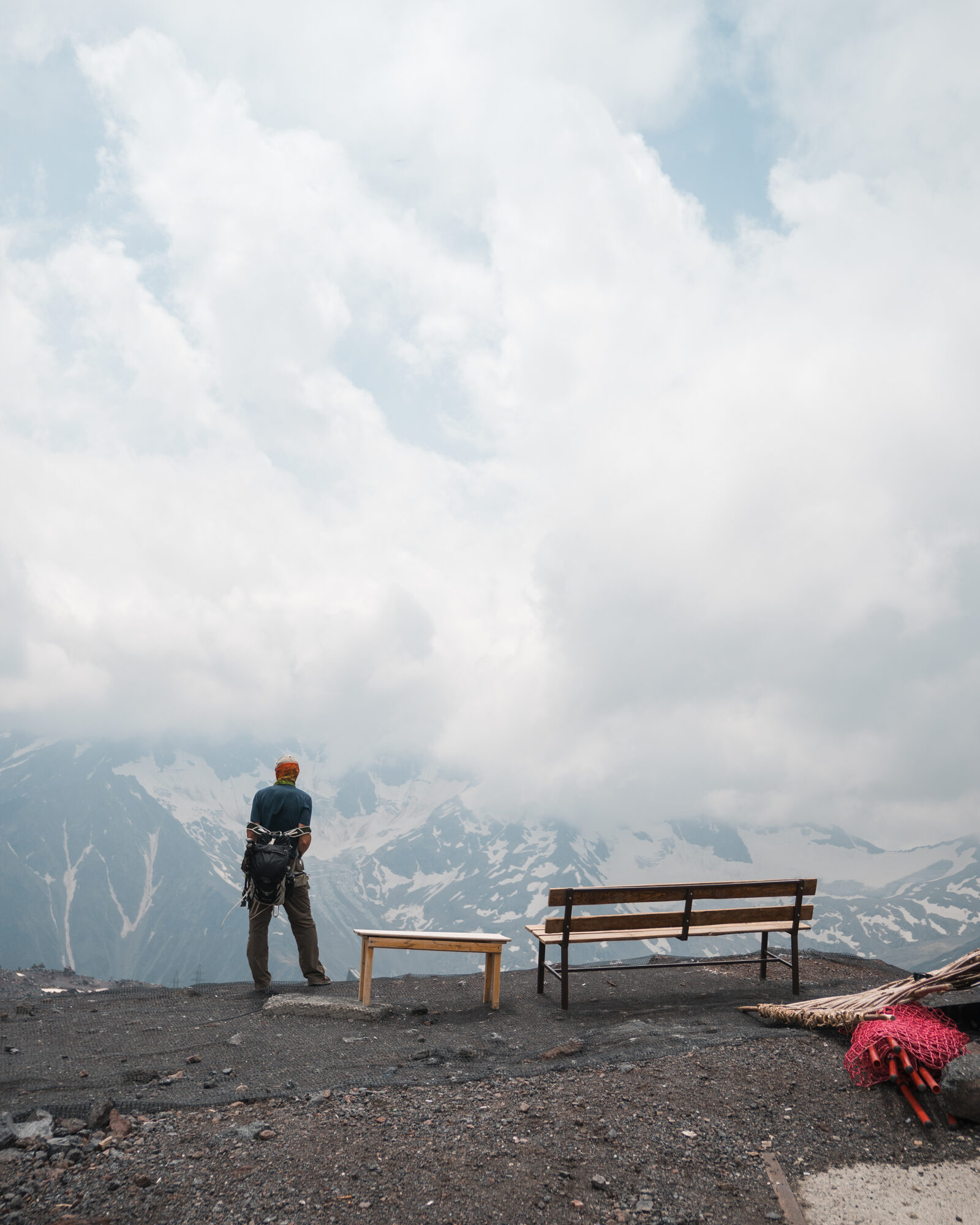 Jason standing at a viewpoint near Priut 11 with Caucasus panorama