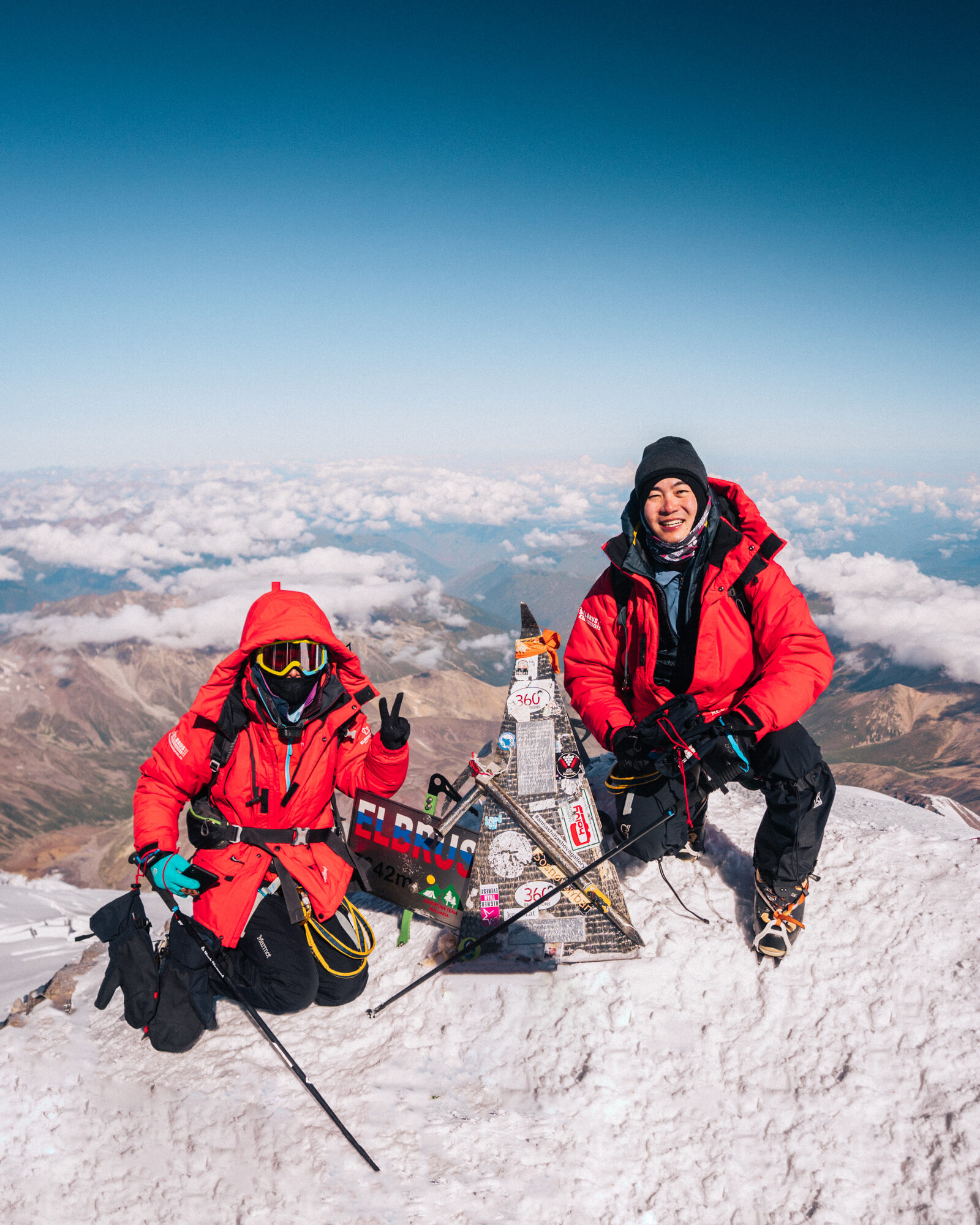 Jason and Grace together at the Elbrus summit sign at 5,642 meters