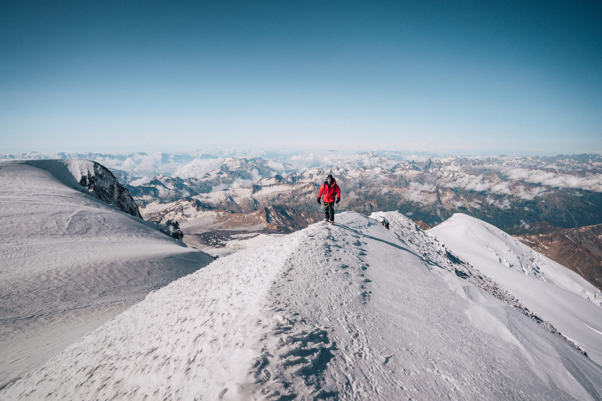 Jason on the Elbrus summit ridge with stunning Caucasus mountain views