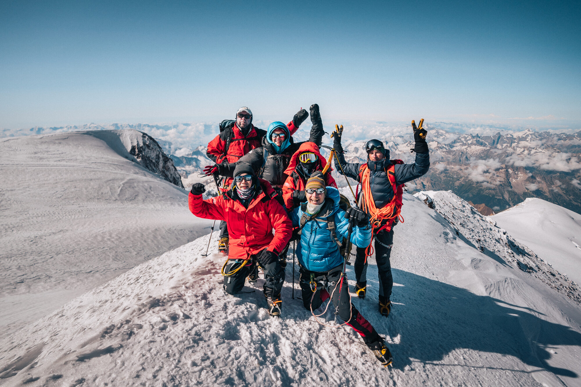 Team celebrating together at the Elbrus summit