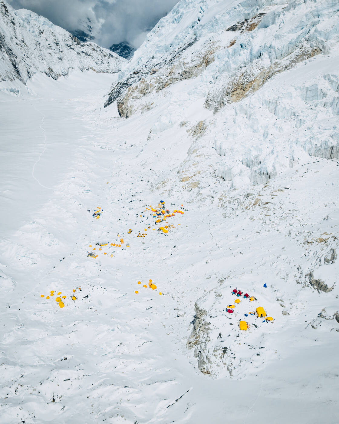 Aerial view of yellow tents at Camp 2 on the rocky moraine