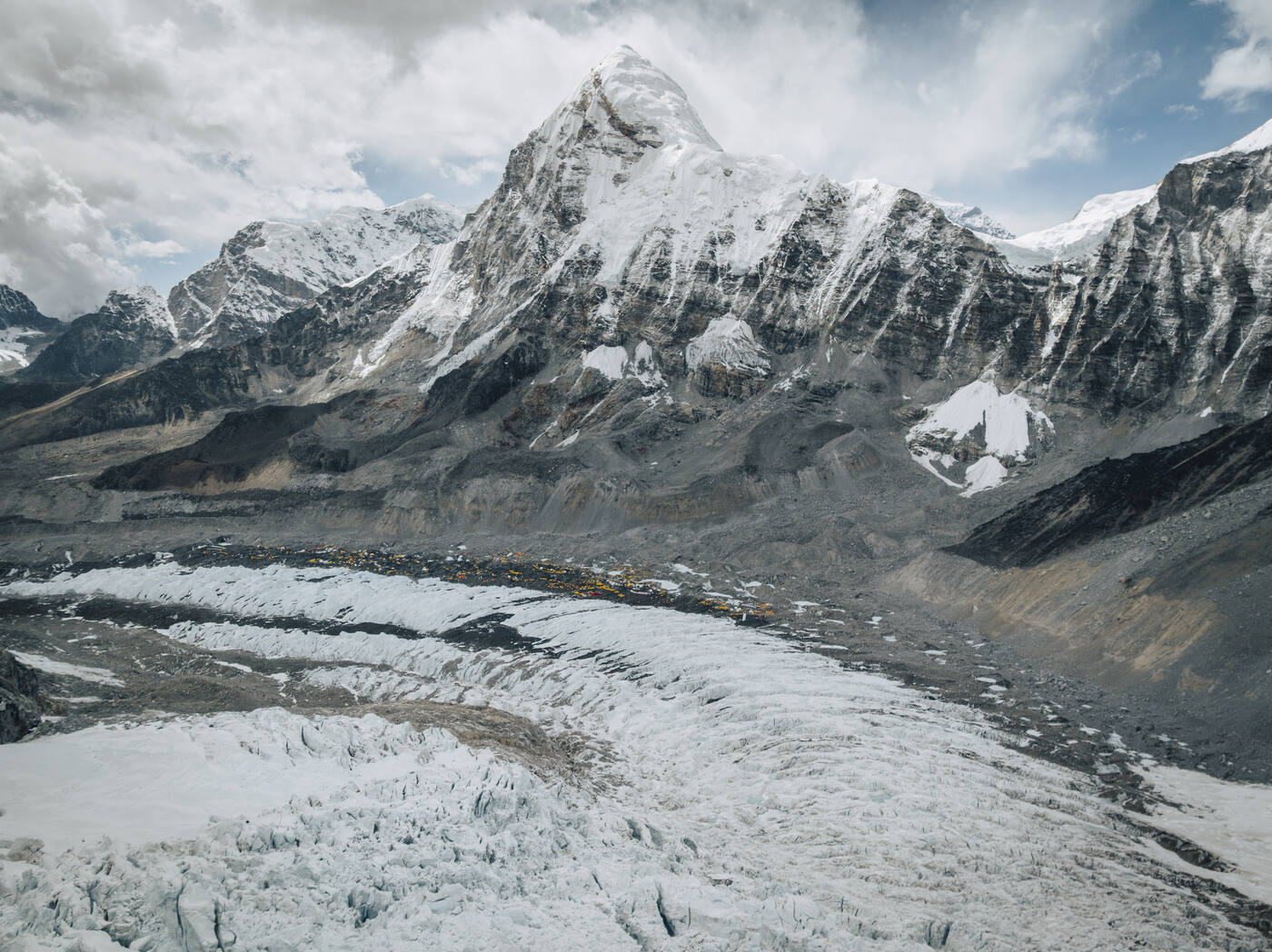 Aerial view of a snow pyramid peak and a broad glacier near Everest Base Camp