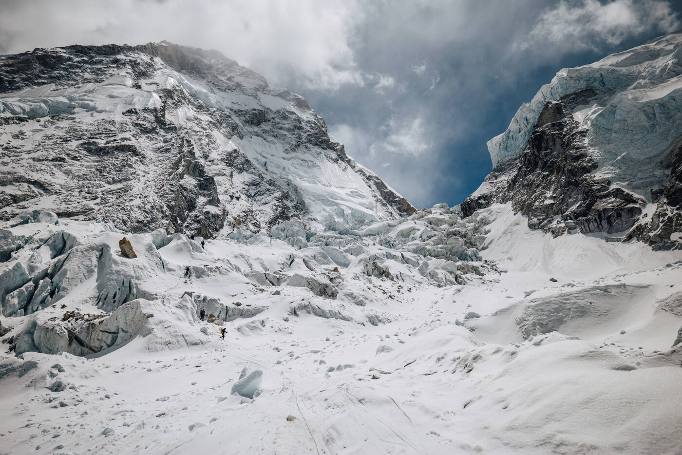 The Khumbu Icefall and the rocky slopes above it under moving cloud