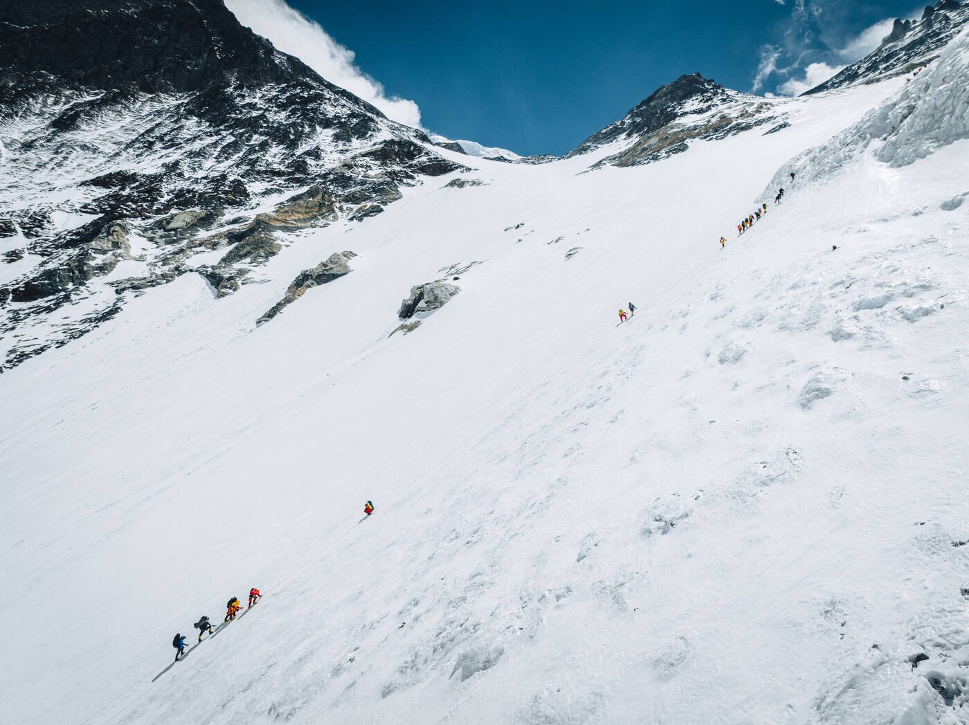 Aerial view of climbers ascending the snow slope of the Lhotse Face