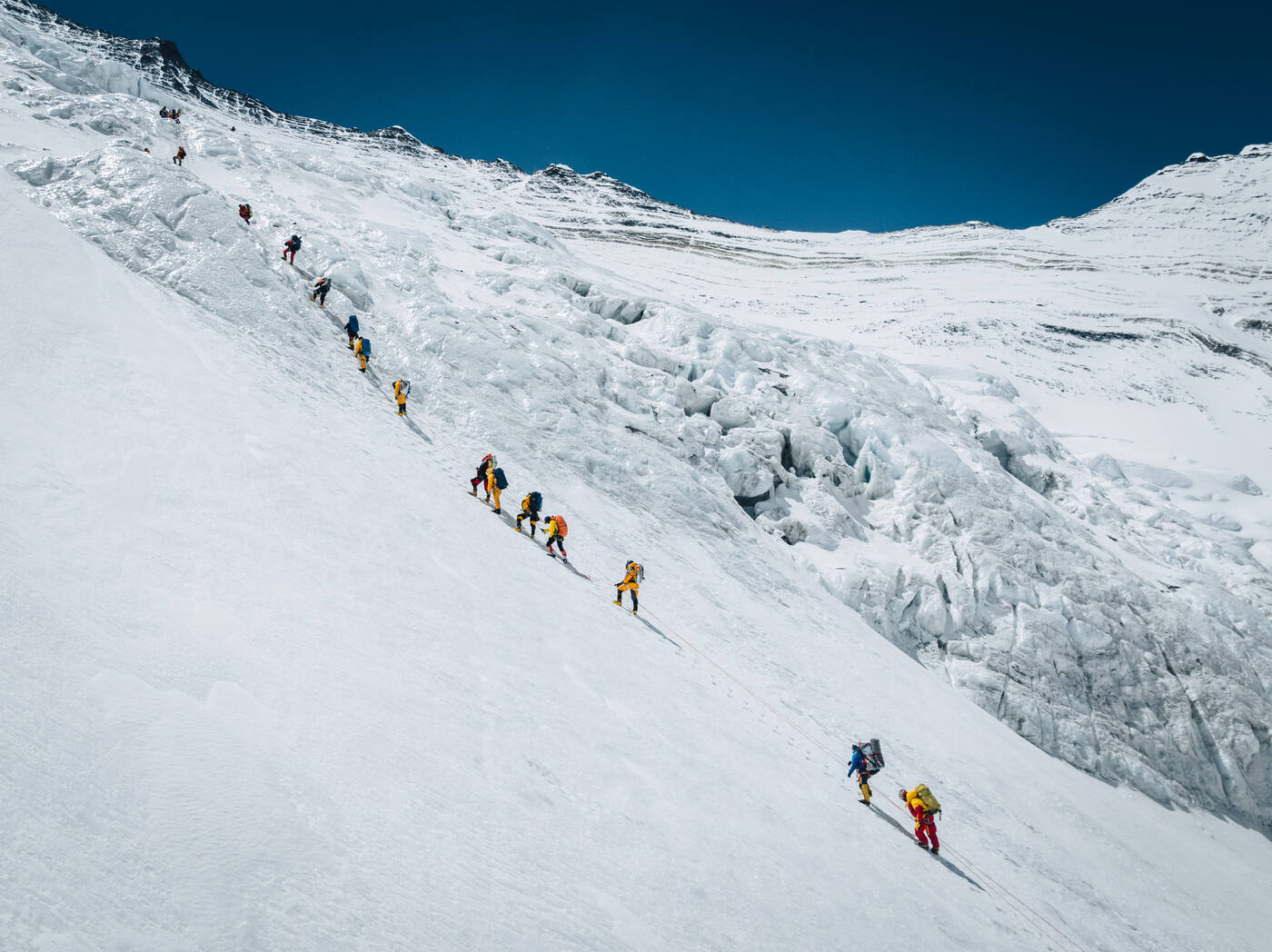 Aerial view of climbers strung out on fixed ropes across the Lhotse Face