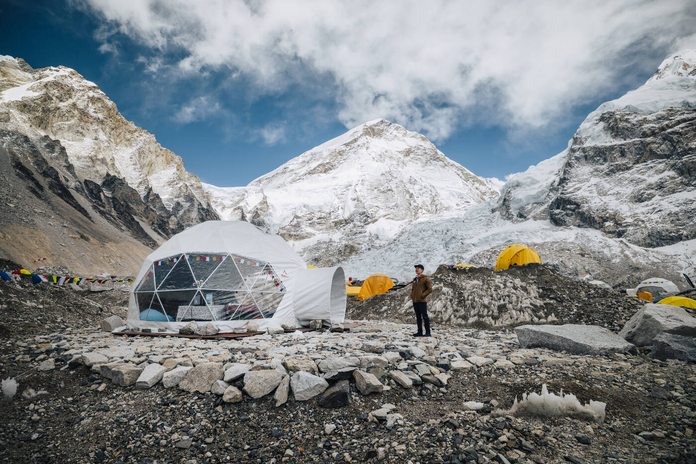 Geodesic dome tent at Everest Base Camp with the Khumbu Icefall and snow-covered peaks behind