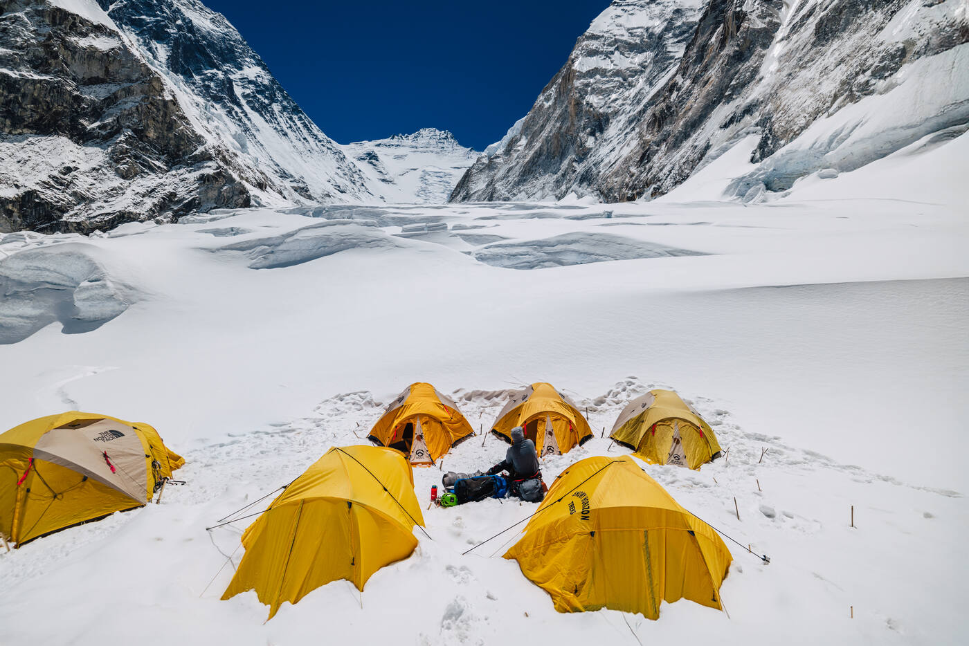 Yellow tents at Camp 2 with the massive Lhotse Face rising behind