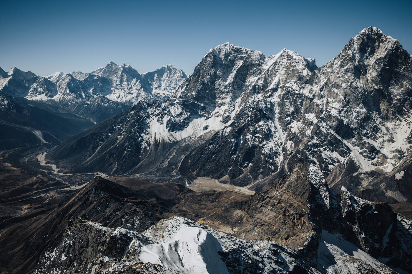 Aerial drone panorama of snow-covered Himalayan peaks seen from Lobuche East summit altitude