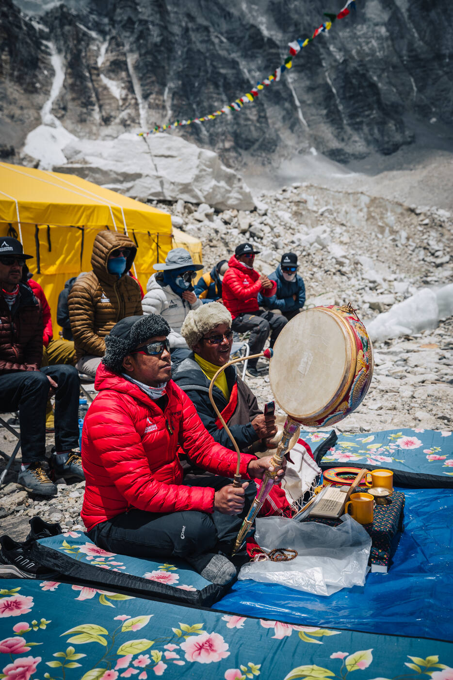 Buddhist monk playing a ceremonial drum during the Puja ceremony at Everest Base Camp