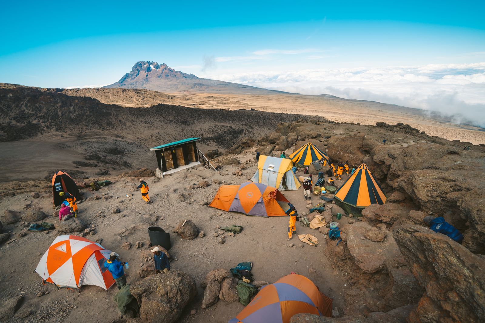 Barafu base camp tents on barren volcanic plateau below the summit