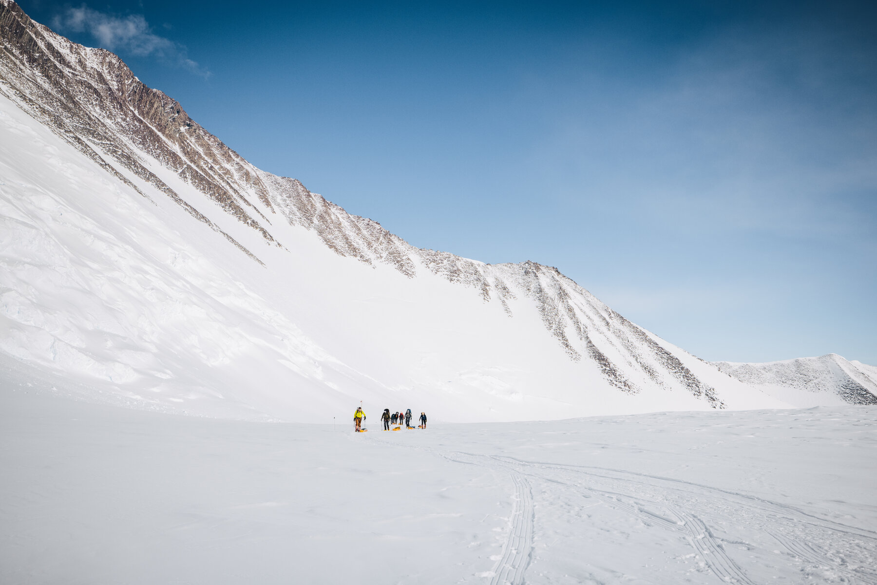 Panoramic view of the glacier approach to Vinson with climbers as small dots on the ice