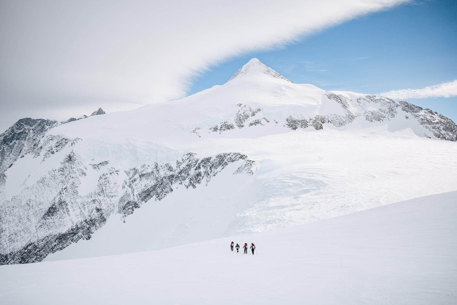 Wide panoramic view from High Camp showing snow-covered peaks and glacier