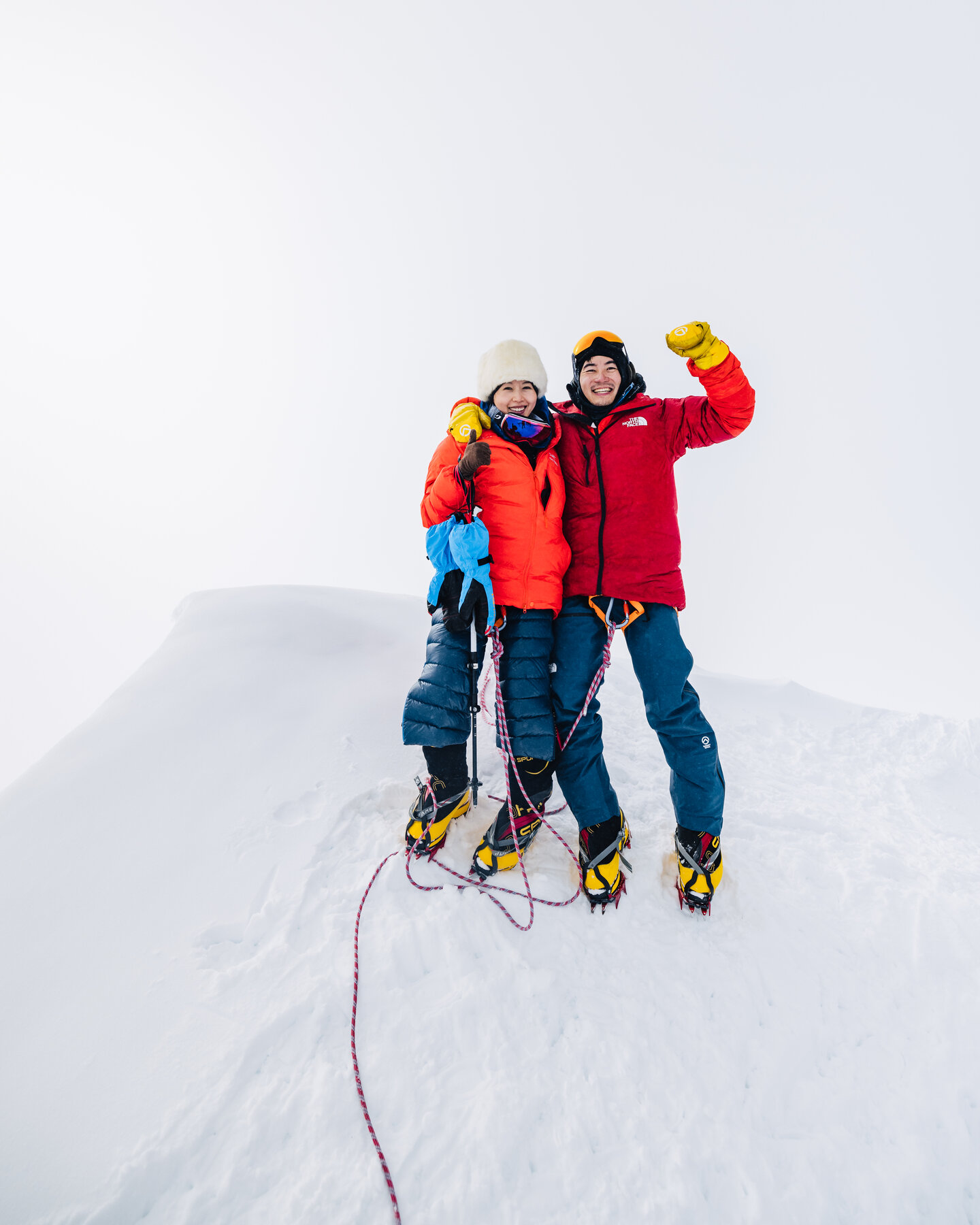 Two climbers embracing at the summit of Vinson